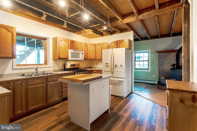 kitchen with baseboard heating, a sink, wood counters, white appliances, and dark wood finished floors