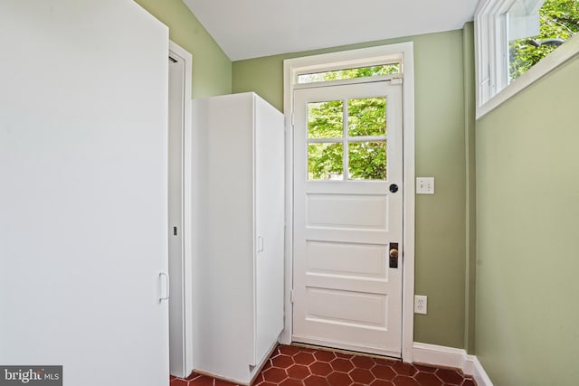 entryway with a healthy amount of sunlight and baseboards