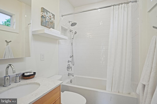 full bath with vanity, shower / bath combo, and toilet