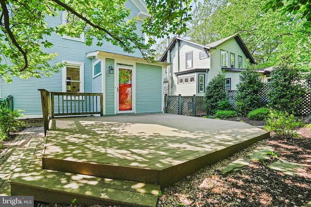 rear view of house with a deck