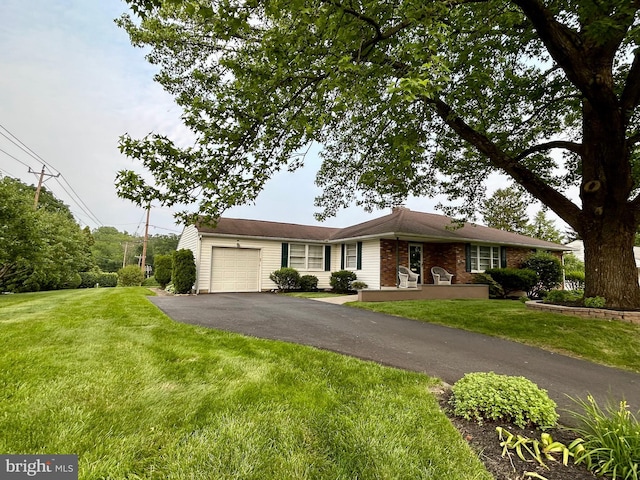 113 Edgeroad Ln, Wilmington, DE 19803 - ranch-style house with a garage, driveway, a front yard, and brick siding