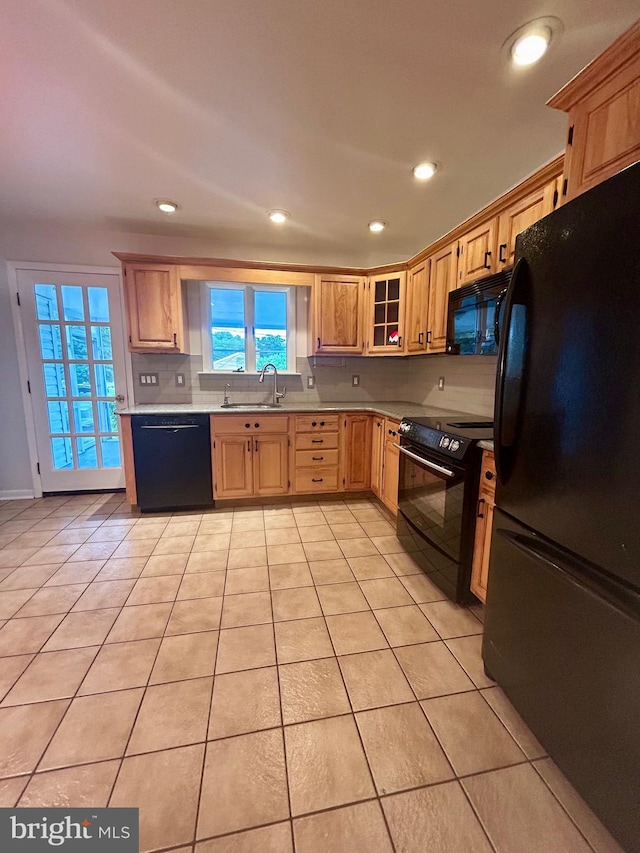 113 Edgeroad Ln, Wilmington, DE 19803 - kitchen featuring black appliances, a sink, light tile patterned flooring, recessed lighting, and light countertops