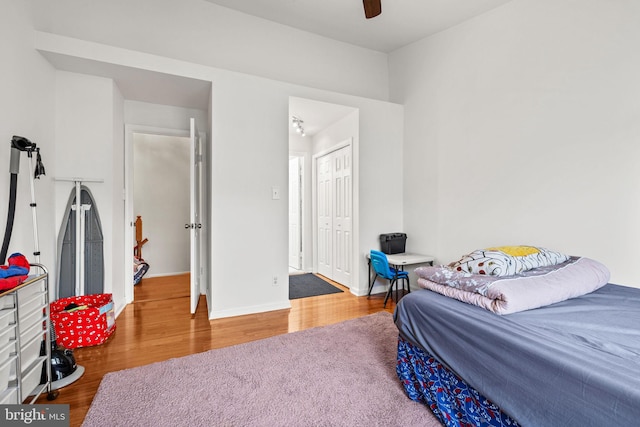 4045 Chetham Way, Woodbridge, VA 22192 - bedroom with a closet, baseboards, wood finished floors, and a ceiling fan