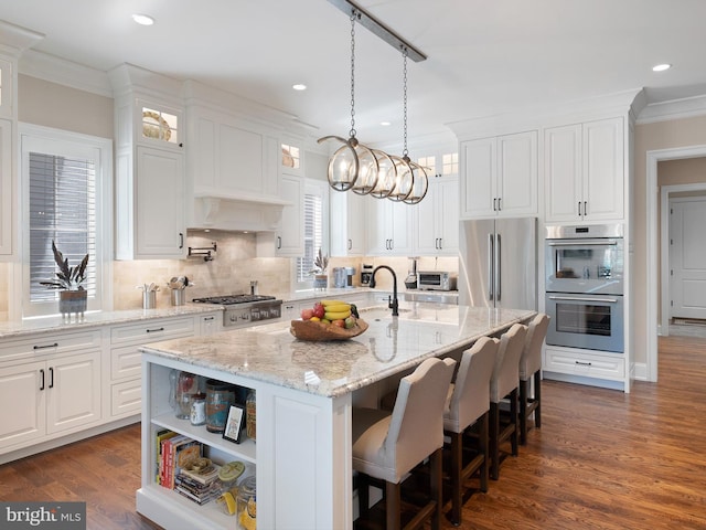 kitchen featuring ornamental molding, white cabinets, and stainless steel appliances