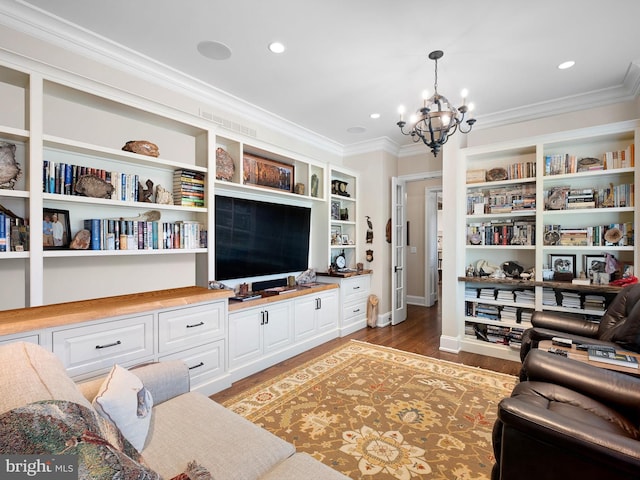 living area featuring baseboards, light wood finished floors, a notable chandelier, ornamental molding, and recessed lighting