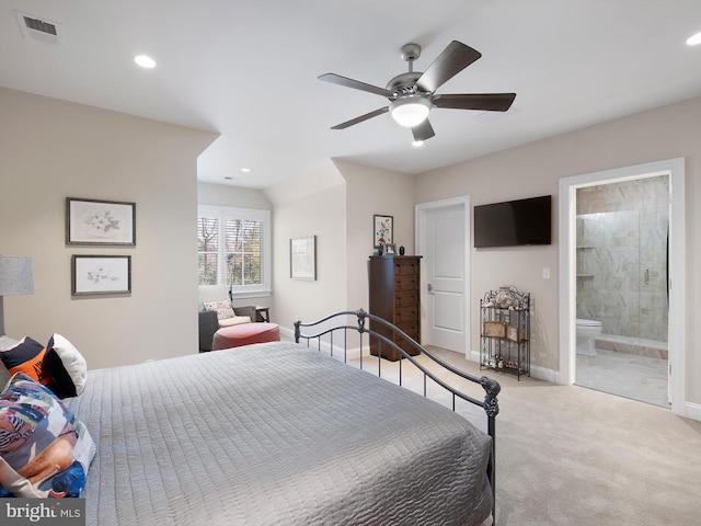 carpeted bedroom featuring baseboards, ensuite bathroom, recessed lighting, and visible vents