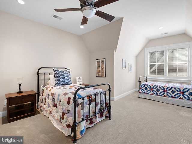 bedroom featuring carpet floors, baseboards, visible vents, and lofted ceiling