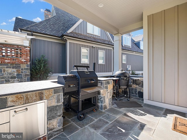 view of patio / terrace featuring exterior kitchen and area for grilling