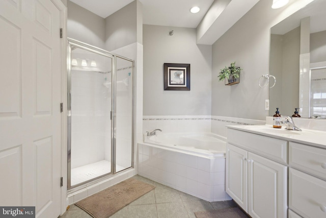 820 Belmont Bay Dr Unit 405, Woodbridge, VA 22191 - bathroom with a bath, a shower stall, tile patterned flooring, and vanity