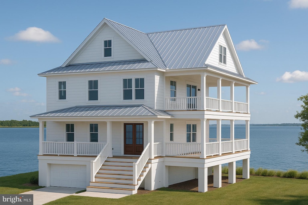coastal inspired home with a water view, a balcony, covered porch, and stairway