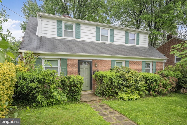 10019 Greenock Rd, Silver Spring, MD 20901 - view of front of house featuring a front lawn, brick siding, entry steps, and a shingled roof