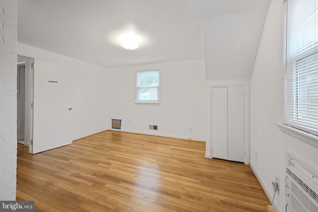 10019 Greenock Rd, Silver Spring, MD 20901 - additional living space featuring light wood-style flooring, an AC wall unit, and baseboards