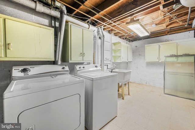 10019 Greenock Rd, Silver Spring, MD 20901 - laundry room with washer and dryer, cabinet space, and light flooring