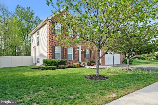 view of front of house with fence and a front yard
