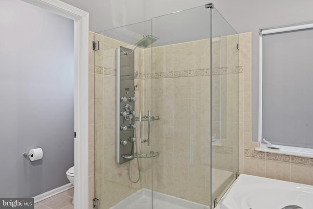 bathroom with tile patterned floors, a bath, toilet, and a shower stall