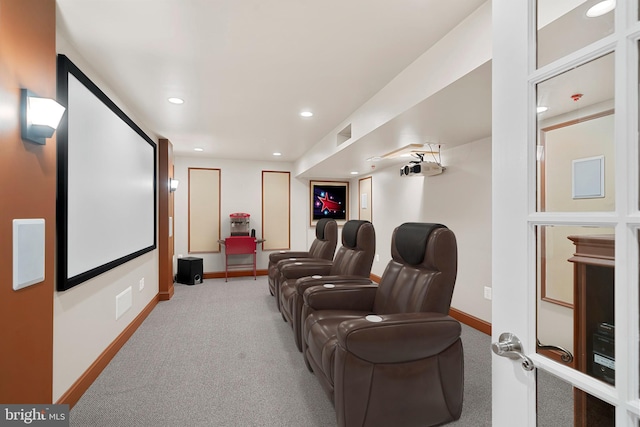 carpeted home theater room with baseboards and recessed lighting