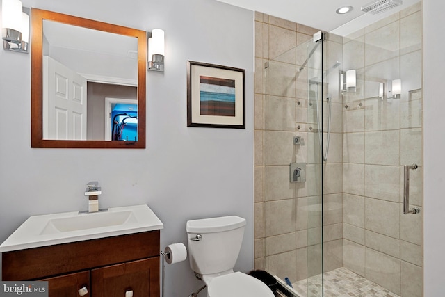 bathroom with visible vents, vanity, toilet, recessed lighting, and a stall shower