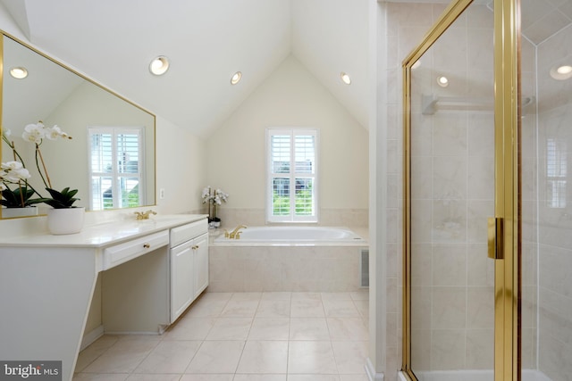 bathroom featuring a garden tub, tile patterned flooring, vaulted ceiling, a shower stall, and vanity