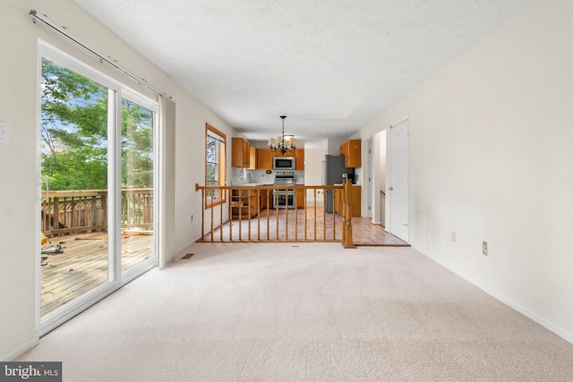 8005 Hillrise Ct, Elkridge, MD 21075 - unfurnished living room featuring a chandelier, light colored carpet, and a sink