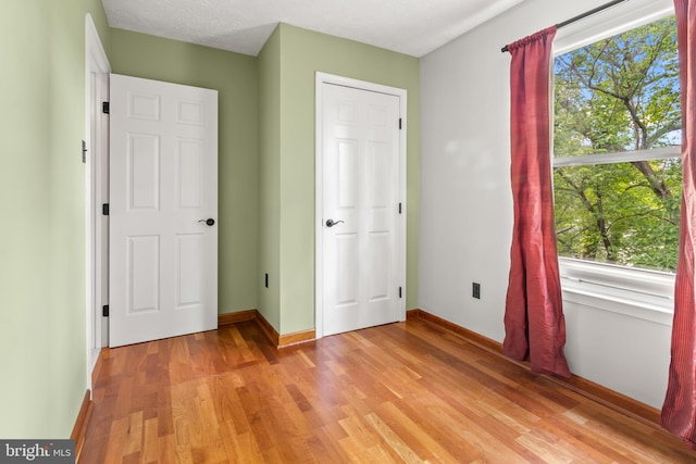 8005 Hillrise Ct, Elkridge, MD 21075 - unfurnished bedroom with light wood-style flooring and baseboards