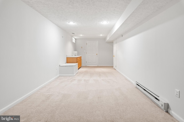 8005 Hillrise Ct, Elkridge, MD 21075 - finished basement with a baseboard heating unit, light colored carpet, a textured ceiling, baseboards, and recessed lighting