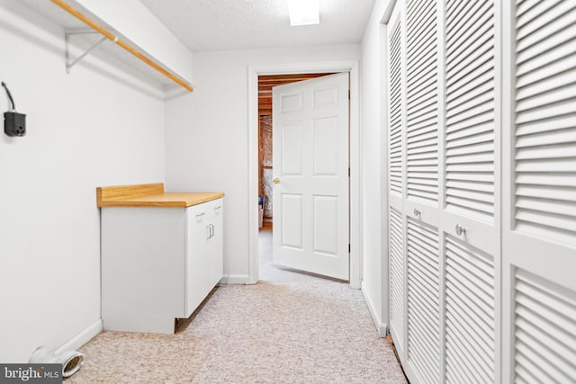 8005 Hillrise Ct, Elkridge, MD 21075 - hall with light carpet, baseboards, and a textured ceiling