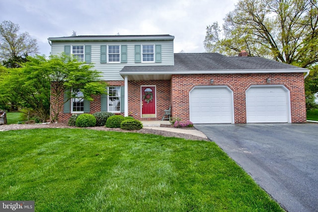 traditional-style home with brick siding, a garage, driveway, roof with shingles, and a front yard