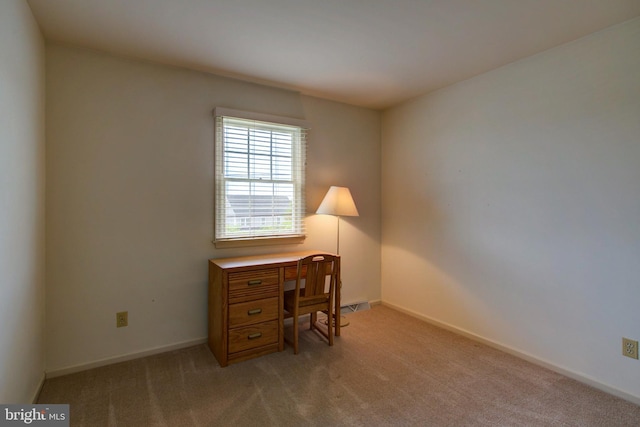 office area with light colored carpet and baseboards