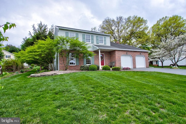 traditional home with a front lawn, driveway, a garage, and brick siding
