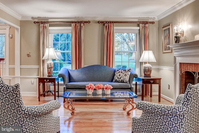 14712 Manor Rd, Phoenix, MD 21131 - living room featuring wood finished floors, ornamental molding, baseboards, and a fireplace