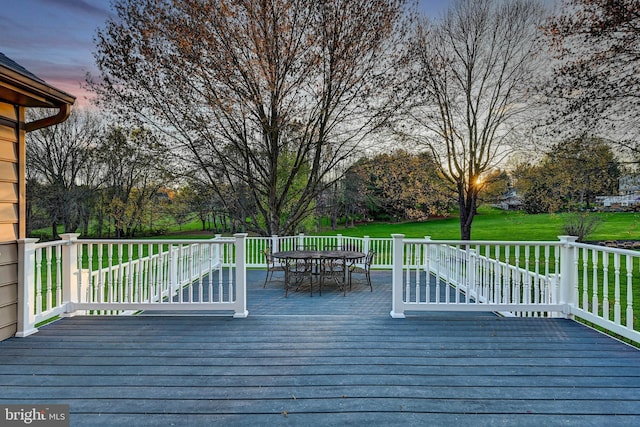 14712 Manor Rd, Phoenix, MD 21131 - deck at dusk featuring outdoor dining space and a lawn