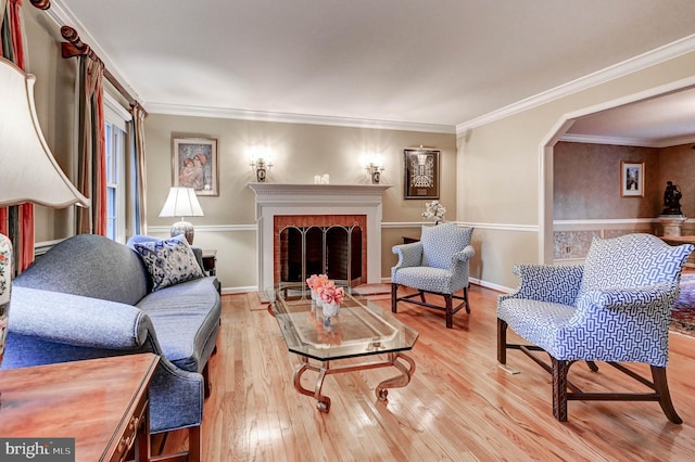 14712 Manor Rd, Phoenix, MD 21131 - living room with wood finished floors, ornamental molding, a brick fireplace, and baseboards