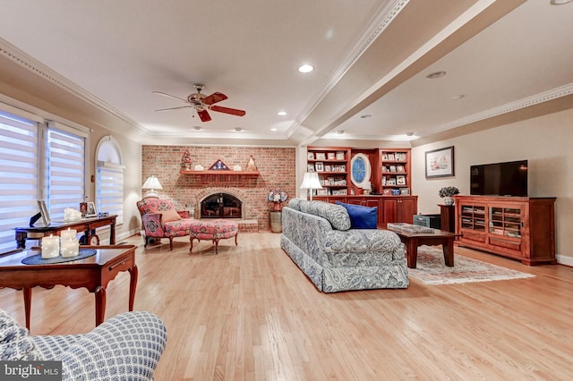 14712 Manor Rd, Phoenix, MD 21131 - living room with light wood-type flooring, ceiling fan, a brick fireplace, ornamental molding, and baseboards