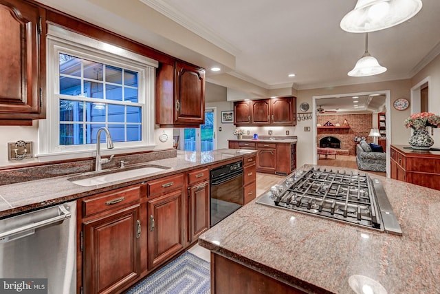 14712 Manor Rd, Phoenix, MD 21131 - kitchen with appliances with stainless steel finishes, a sink, a brick fireplace, ornamental molding, and pendant lighting