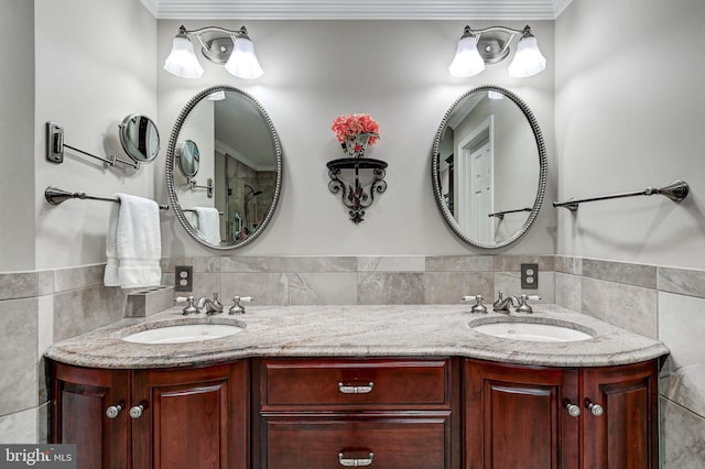 14712 Manor Rd, Phoenix, MD 21131 - bathroom with double vanity, tile walls, and ornamental molding