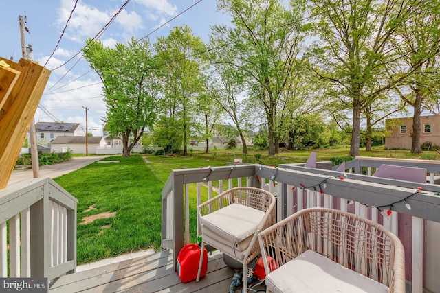 deck featuring a lawn