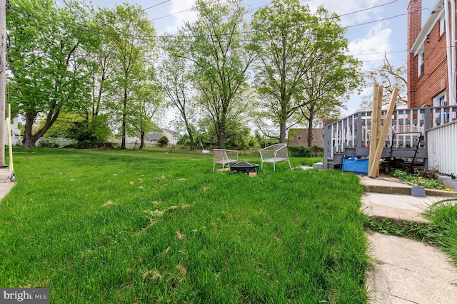 view of yard featuring a wooden deck