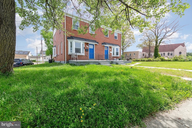 view of front of house with brick siding