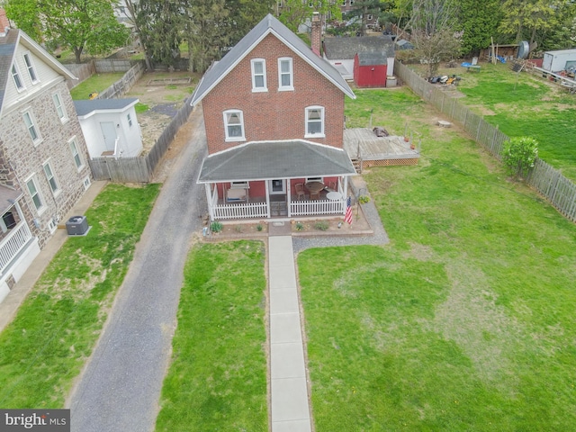 718 Walnut St, Royersford, PA 19468 - view of front of house featuring a chimney, central air condition unit, a wooden deck, brick siding, and driveway