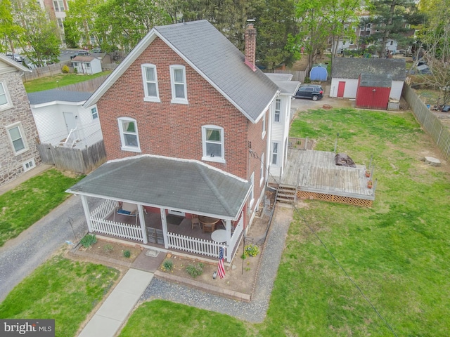 718 Walnut St, Royersford, PA 19468 - back of house featuring a chimney, a deck, brick siding, and a shingled roof