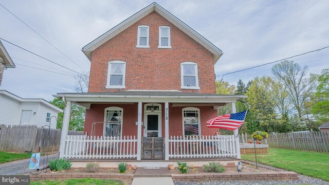 718 Walnut St, Royersford, PA 19468 - view of front facade featuring covered porch and brick siding