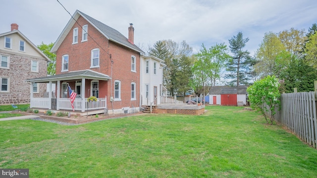 718 Walnut St, Royersford, PA 19468 - view of home's exterior with covered porch, a chimney, brick siding, and a wooden deck