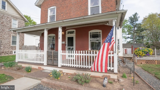 718 Walnut St, Royersford, PA 19468 - view of front of house featuring covered porch and brick siding