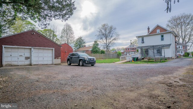 718 Walnut St, Royersford, PA 19468 - view of home's exterior with a chimney, an outbuilding, and a garage