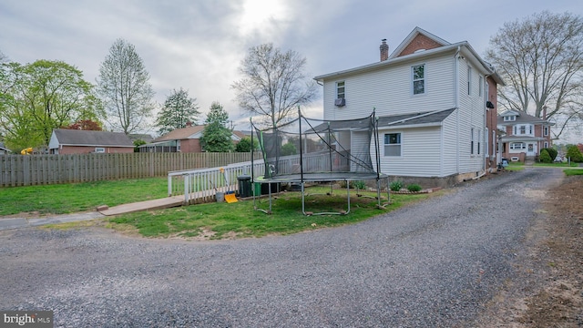 718 Walnut St, Royersford, PA 19468 - back of house featuring a trampoline and a chimney
