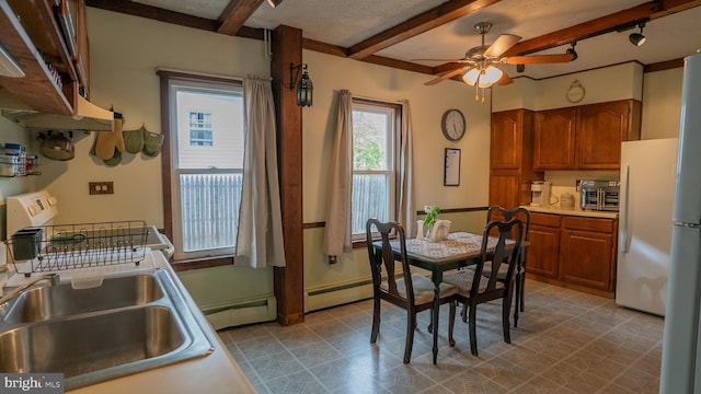 718 Walnut St, Royersford, PA 19468 - dining area featuring beamed ceiling, a ceiling fan, and a baseboard heating unit