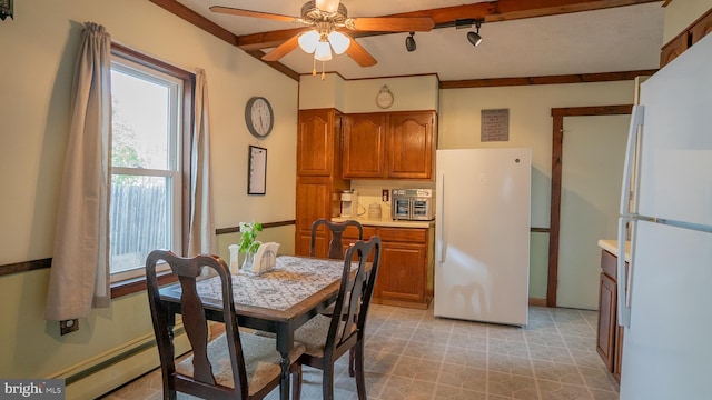 718 Walnut St, Royersford, PA 19468 - dining room with ceiling fan, light flooring, and baseboard heating