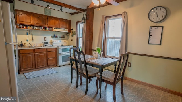 718 Walnut St, Royersford, PA 19468 - dining room with ceiling fan, baseboards, and beamed ceiling