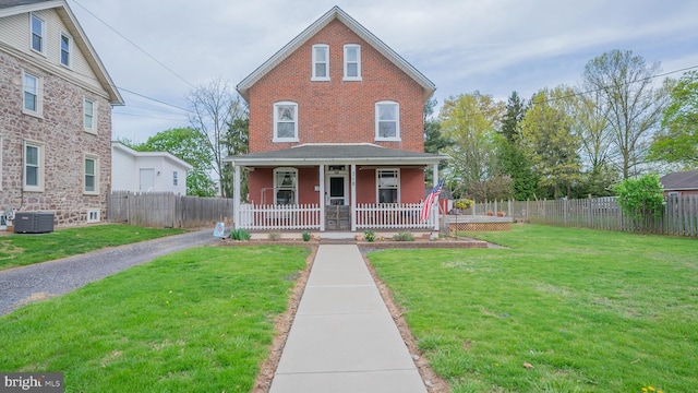 718 Walnut St, Royersford, PA 19468 - view of front facade featuring a porch, central air condition unit, and brick siding