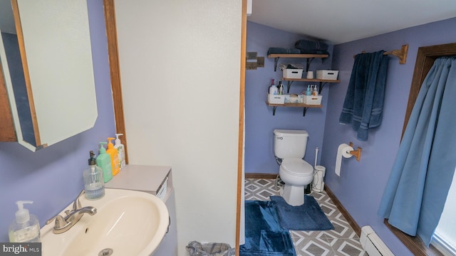 718 Walnut St, Royersford, PA 19468 - full bath with toilet, baseboard heating, lofted ceiling, and a sink